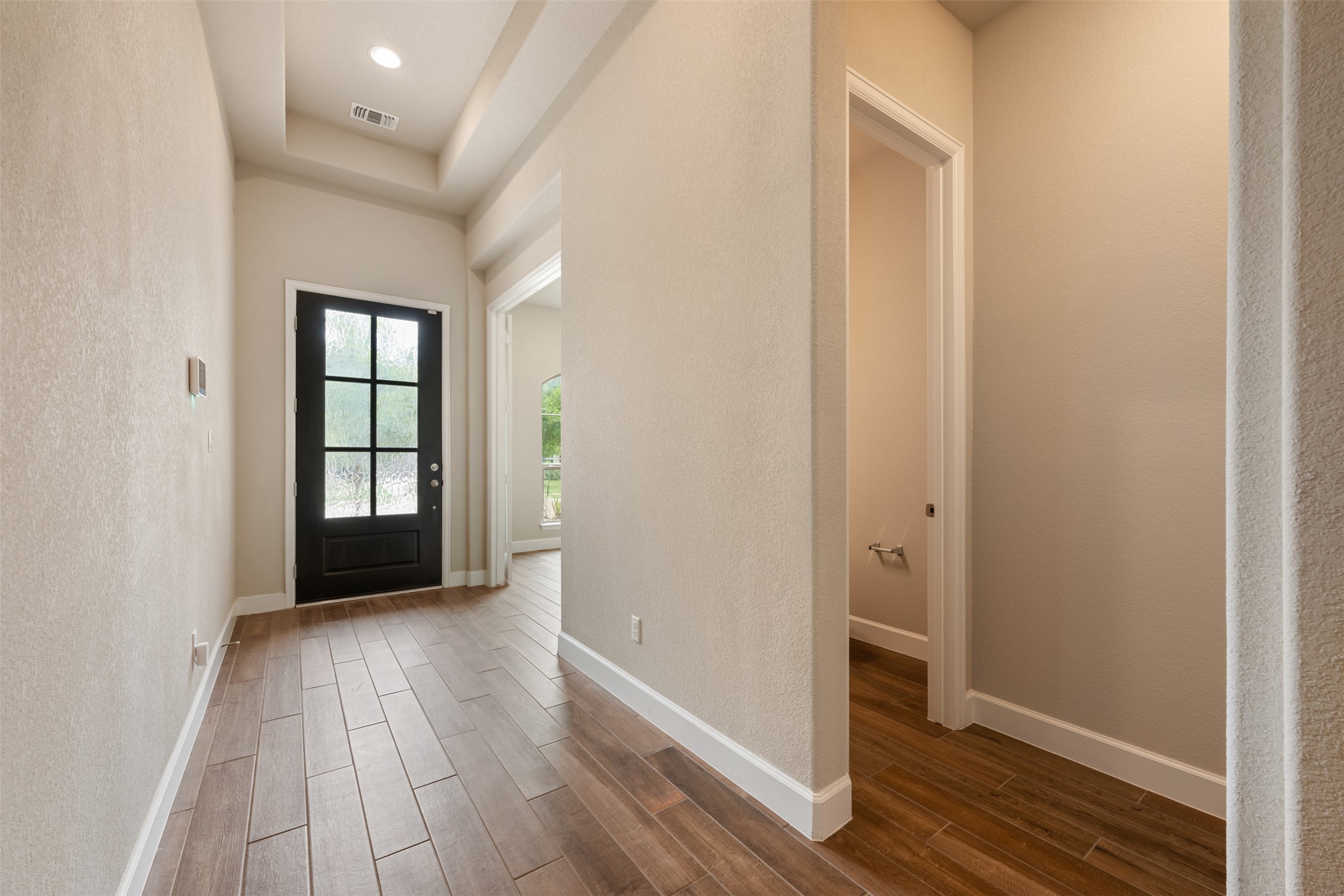 104 Anejo Bluff Georgetown, TX 78628 - Photo 32 of 40 a view of an empty room with wooden floor and a window