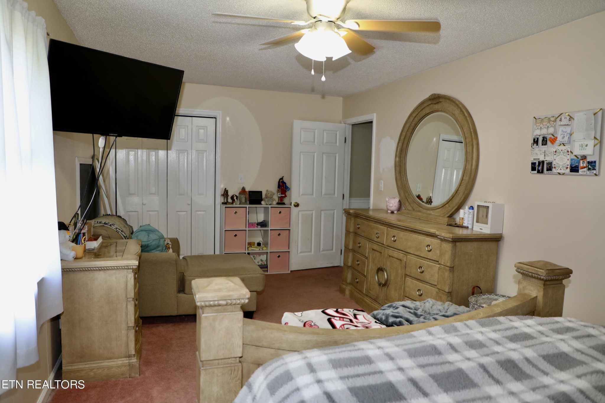 166 Donaldson Road Philadelphia, TN 37846 - Photo 17 of 42 a bedroom with a bed and a flat screen tv