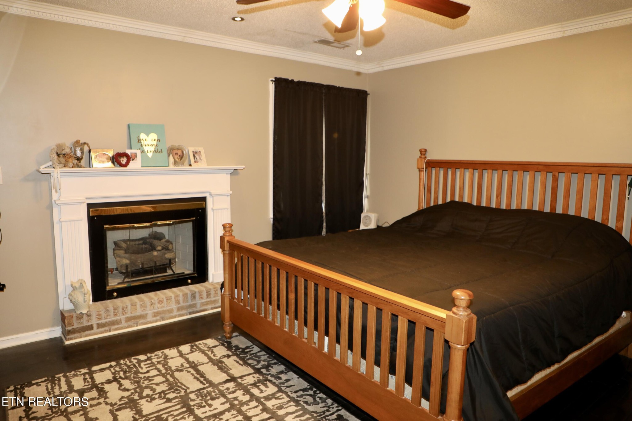 166 Donaldson Road Philadelphia, TN 37846 - Photo 22 of 42 a bedroom with bed and a fireplace