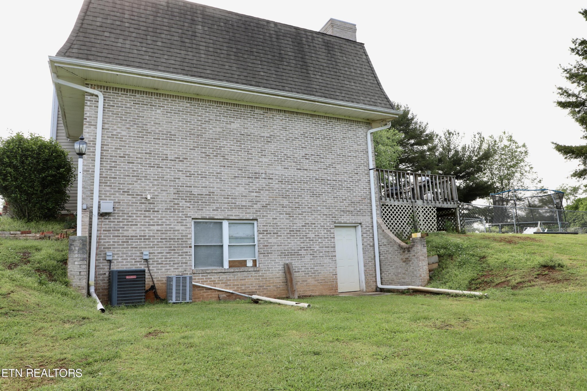 166 Donaldson Road Philadelphia, TN 37846 - Photo 36 of 42 a brick house with a yard