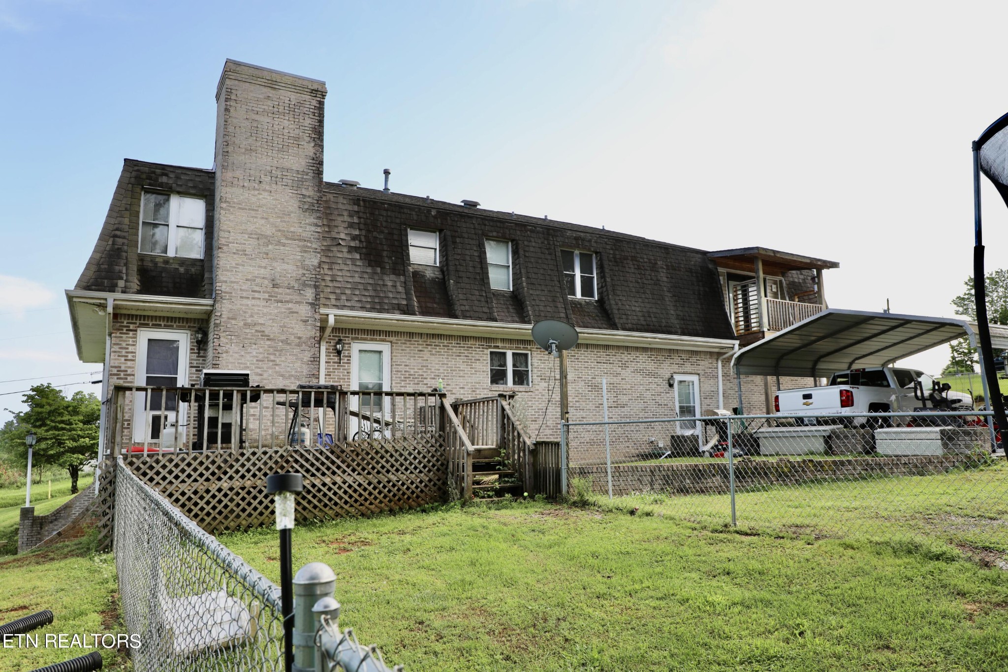 166 Donaldson Road Philadelphia, TN 37846 - Photo 41 of 42 a view of a house with backyard and porch
