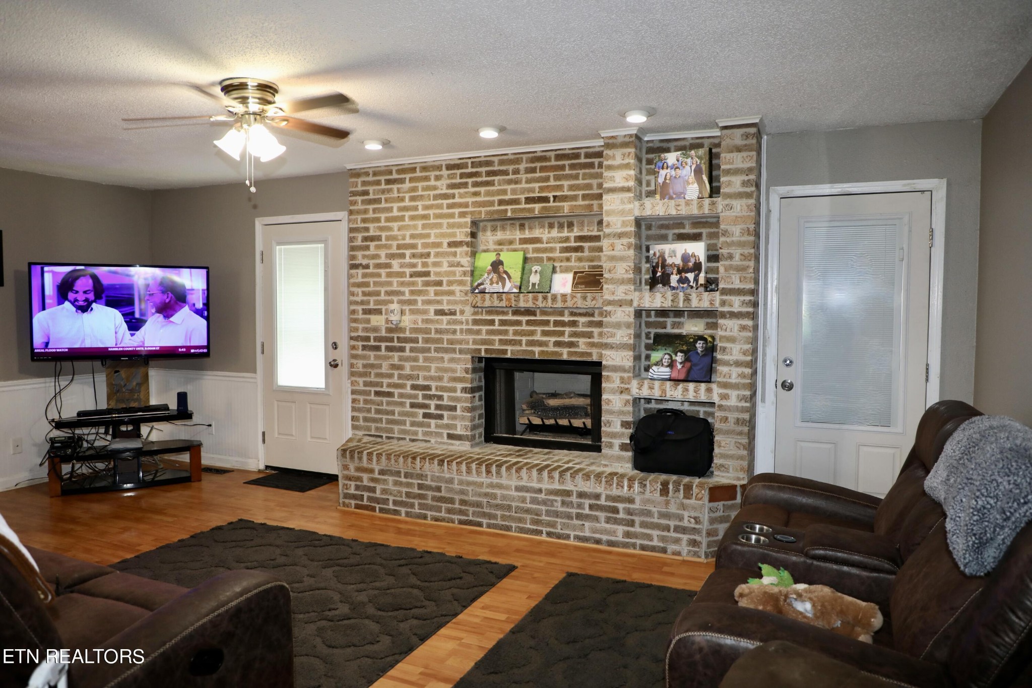 166 Donaldson Road Philadelphia, TN 37846 - Photo 5 of 42 a living room with furniture and a fireplace