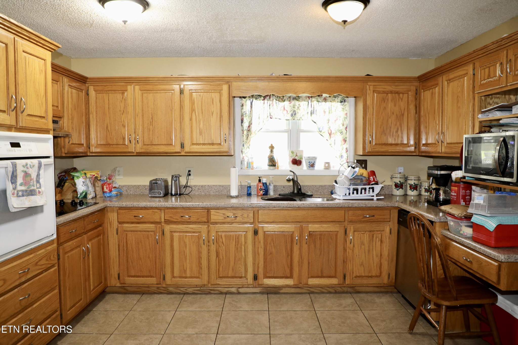 166 Donaldson Road Philadelphia, TN 37846 - Photo 8 of 42 a kitchen with a sink window and cabinets
