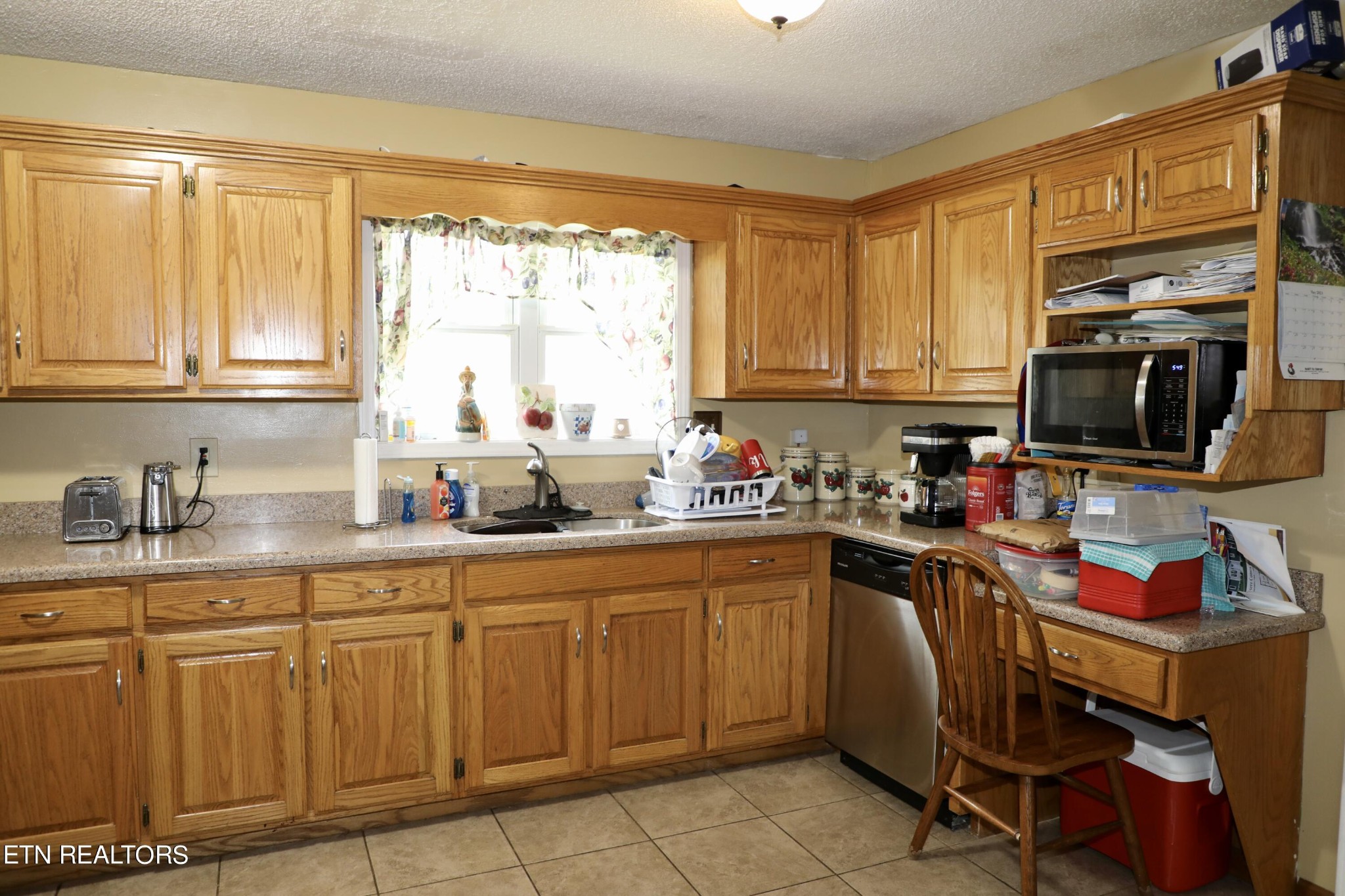 166 Donaldson Road Philadelphia, TN 37846 - Photo 9 of 42 a kitchen with cabinets appliances a window and a center island