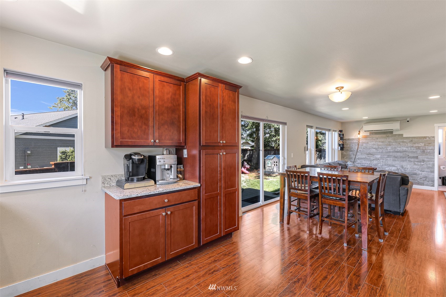 4601 Hall Road Blaine, WA 98230 - Photo 21 of 39 a open kitchen with stainless steel appliances granite countertop a stove top oven a dining table and chairs with wooden floor