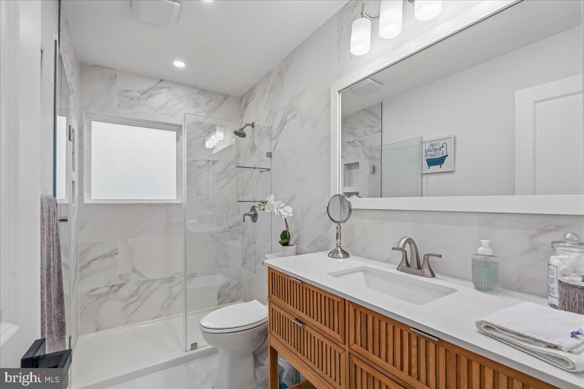 4000 Adams Drive Silver Spring, MD 20902 - Photo 15 of 21 Sleek modern bathroom with marble accents.
