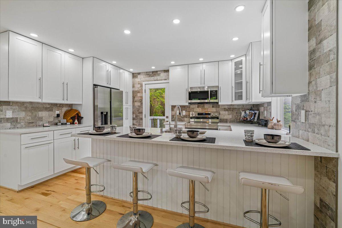 4000 Adams Drive Silver Spring, MD 20902 - Photo 6 of 21 Sleek modern kitchen with natural light.