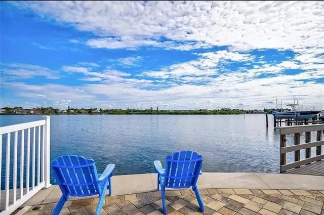 a view of a chairs and table in a yard