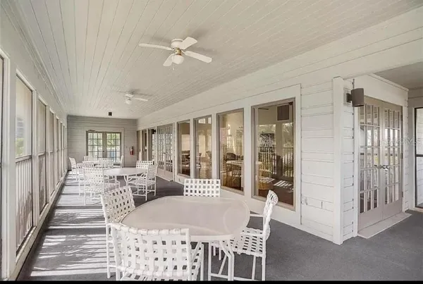 a view of a chairs and table on the deck