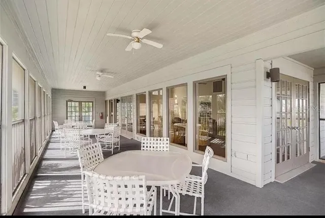 a view of a chairs and table on the deck