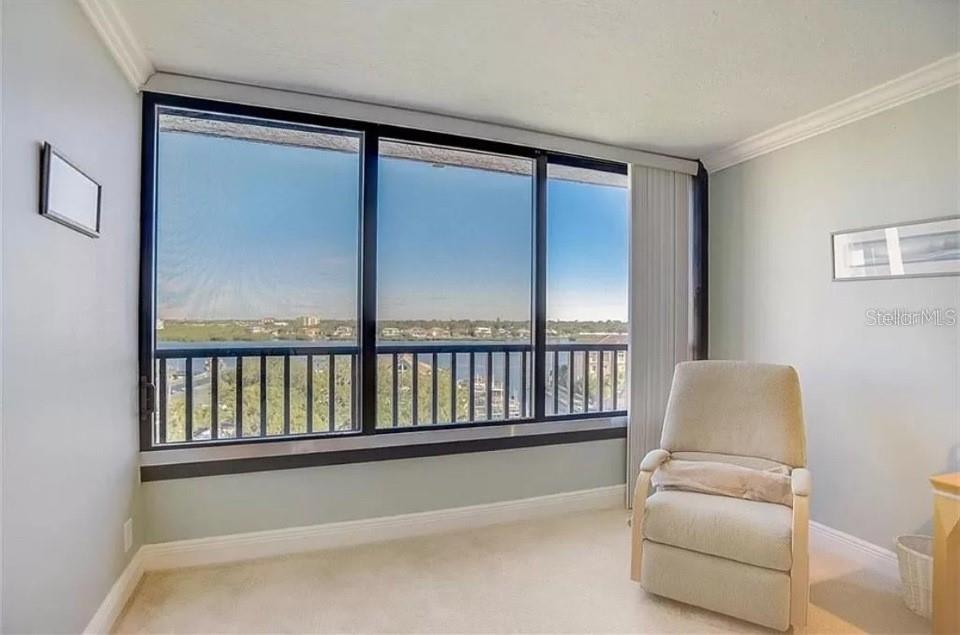 5911 Midnight Pass Road, Unit 601 Sarasota, FL 34242 - Photo 27 of 48 a living room with furniture and a window