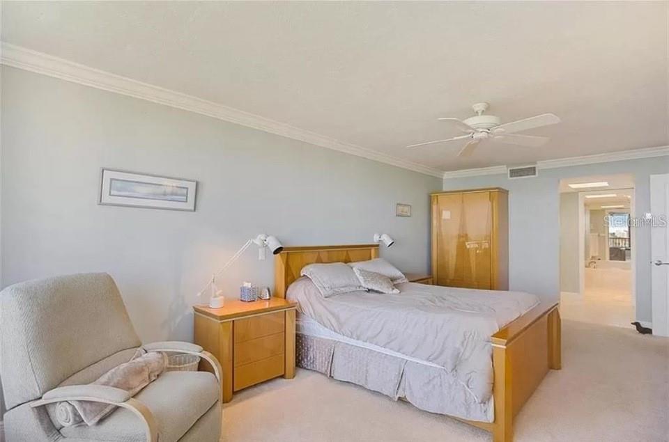 5911 Midnight Pass Road, Unit 601 Sarasota, FL 34242 - Photo 31 of 48 a bedroom with a bed and window