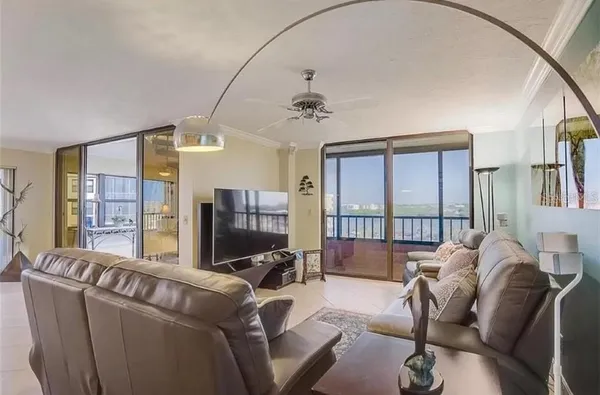 a view of a cafe with a table and chairs under an umbrella