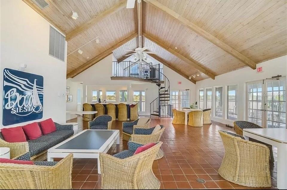 5911 Midnight Pass Road, Unit 601 Sarasota, FL 34242 - Photo 44 of 48 a living room with furniture and wooden floor