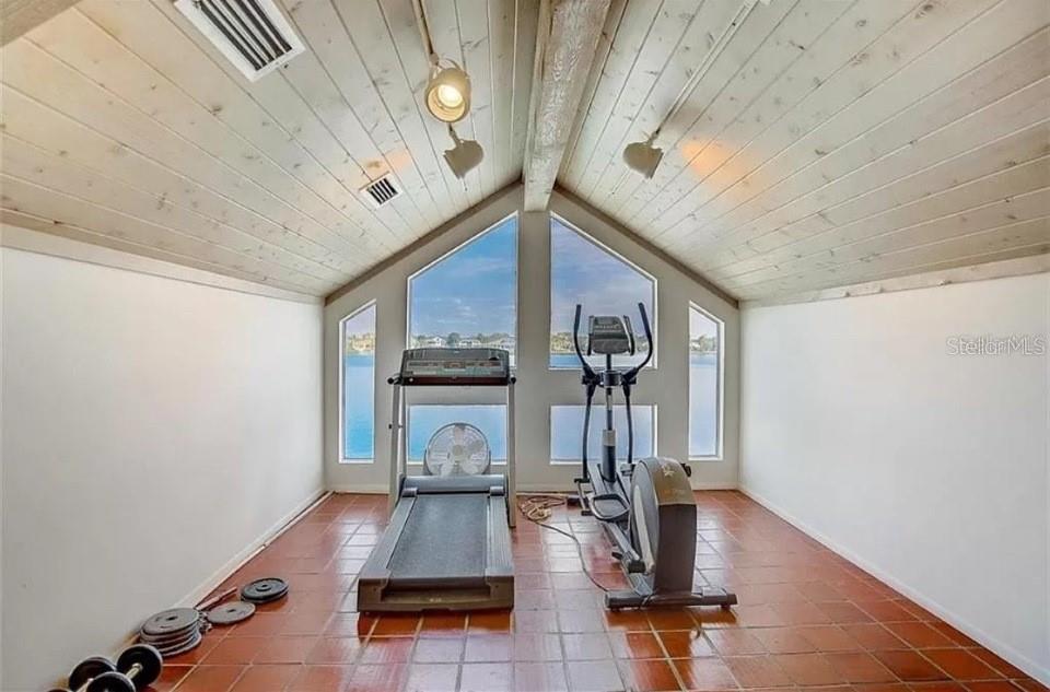 5911 Midnight Pass Road, Unit 601 Sarasota, FL 34242 - Photo 46 of 48 a view of a room with gym equipment