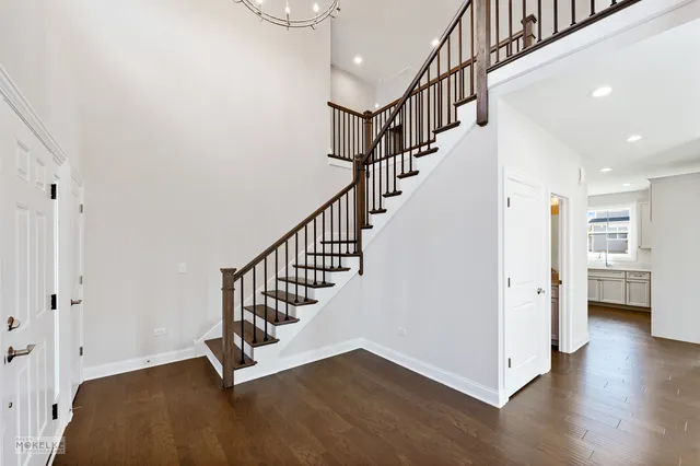 a view of staircase with white walls and floors