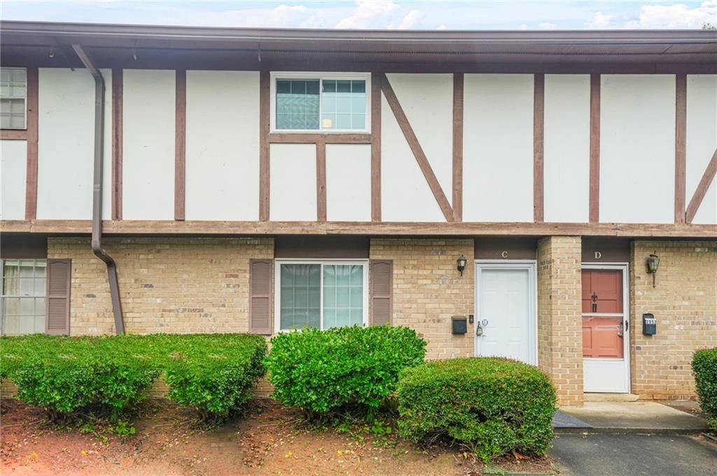 2952 North Dekalb Drive, Unit C Atlanta, GA 30340 - Photo 1 of 27 a front view of a house with large windows