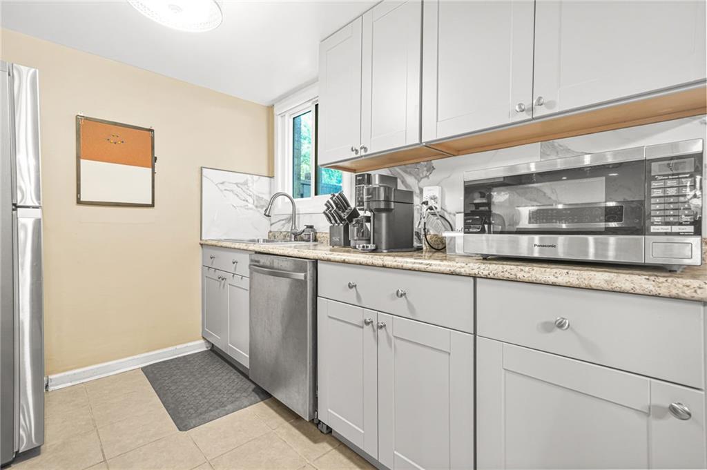 2952 North Dekalb Drive, Unit C Atlanta, GA 30340 - Photo 13 of 27 a kitchen with white cabinets and sink