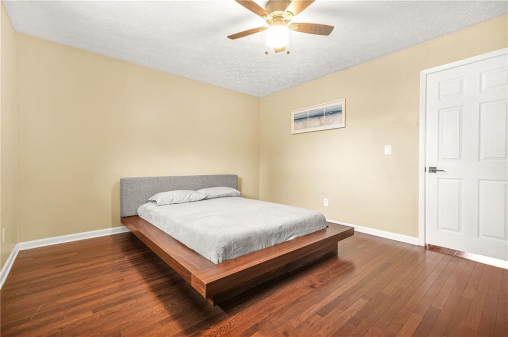 2952 North Dekalb Drive, Unit C Atlanta, GA 30340 - Photo 14 of 27 a bed sitting in a spacious bedroom next to a window