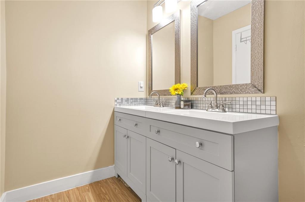 2952 North Dekalb Drive, Unit C Atlanta, GA 30340 - Photo 18 of 27 a bathroom with a sink and a mirror
