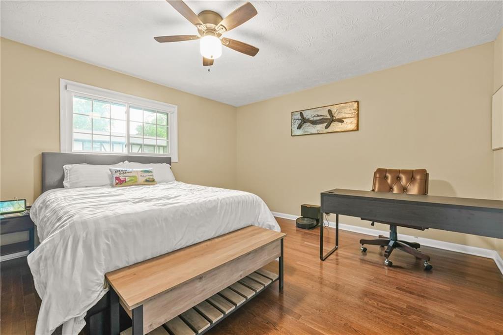 2952 North Dekalb Drive, Unit C Atlanta, GA 30340 - Photo 19 of 27 a bedroom with a bed and a desk