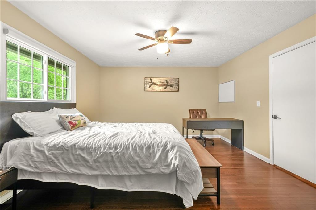 2952 North Dekalb Drive, Unit C Atlanta, GA 30340 - Photo 21 of 27 a bedroom with a bed and a table in it
