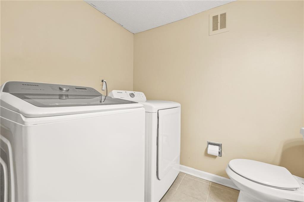 2952 North Dekalb Drive, Unit C Atlanta, GA 30340 - Photo 23 of 27 a utility room with dryer and washer