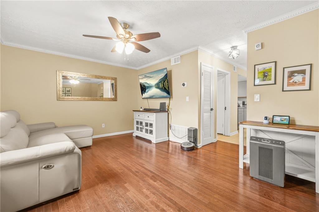 2952 North Dekalb Drive, Unit C Atlanta, GA 30340 - Photo 4 of 27 a living room with furniture and a wooden floor