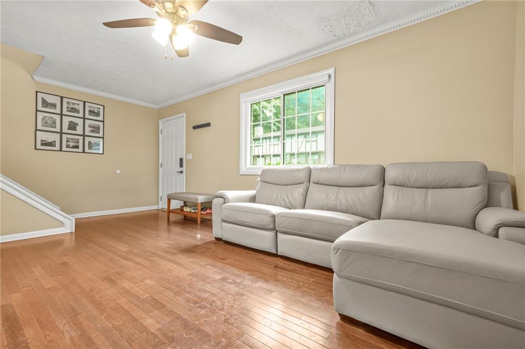 2952 North Dekalb Drive, Unit C Atlanta, GA 30340 - Photo 5 of 27 a living room with furniture and a large window
