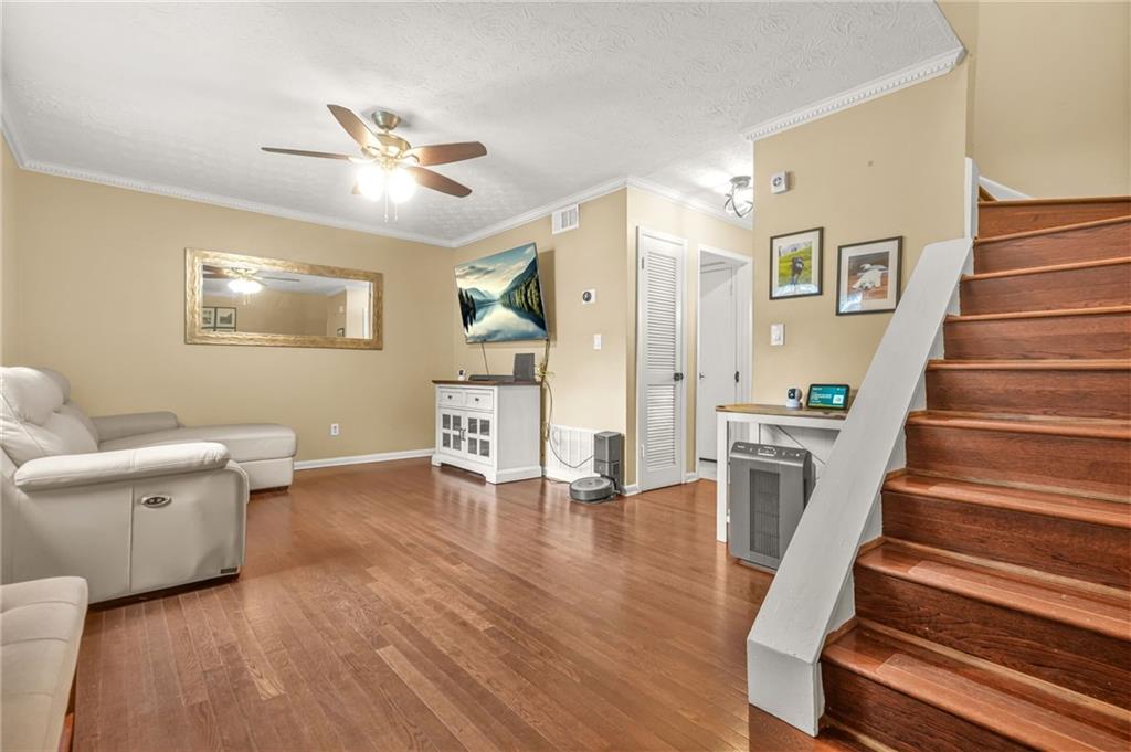 2952 North Dekalb Drive, Unit C Atlanta, GA 30340 - Photo 7 of 27 a living room with furniture and a wooden floor