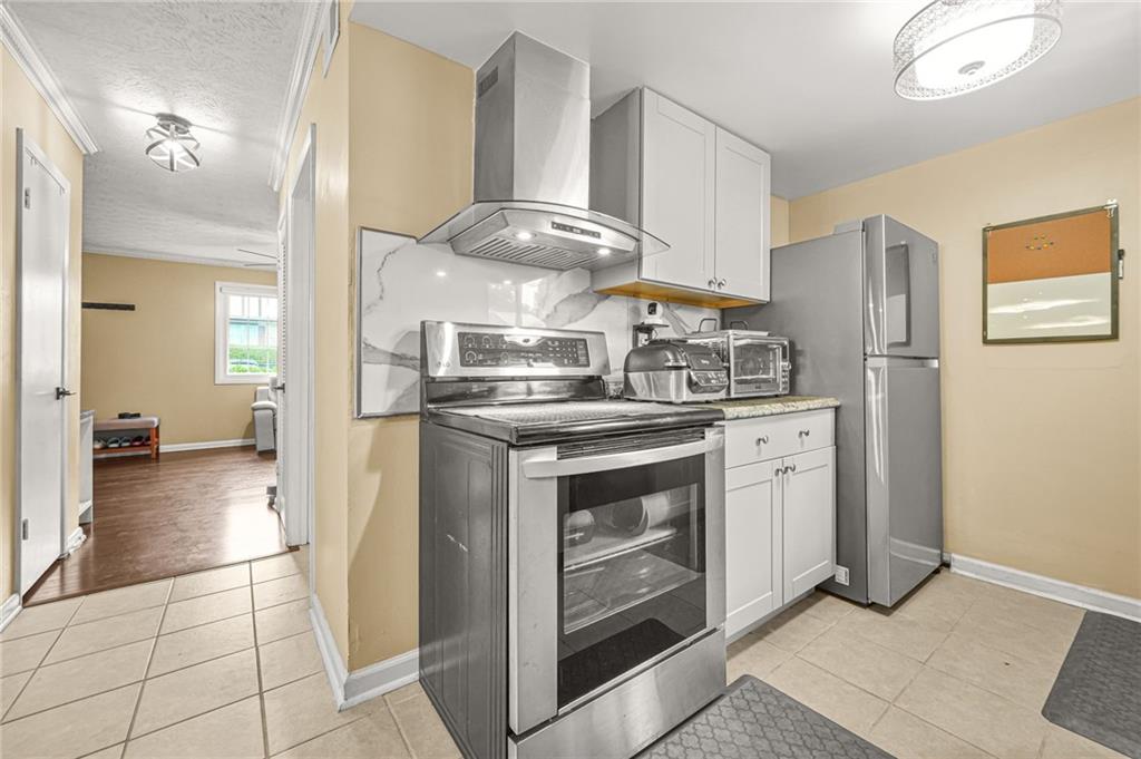 2952 North Dekalb Drive, Unit C Atlanta, GA 30340 - Photo 10 of 27 a kitchen with stainless steel appliances granite countertop a refrigerator and a stove