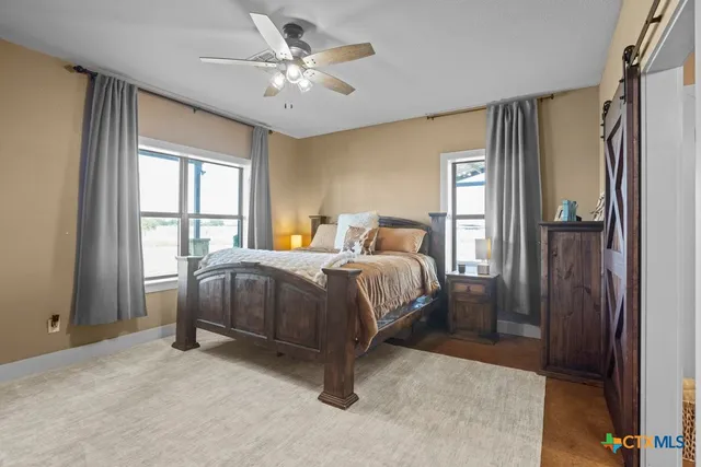 a bathroom with a granite countertop sink a mirror and a