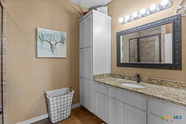 a livingroom with wooden floor and stairs