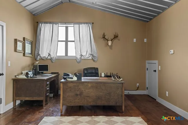 a living room with a couch a rug and a ceiling fan