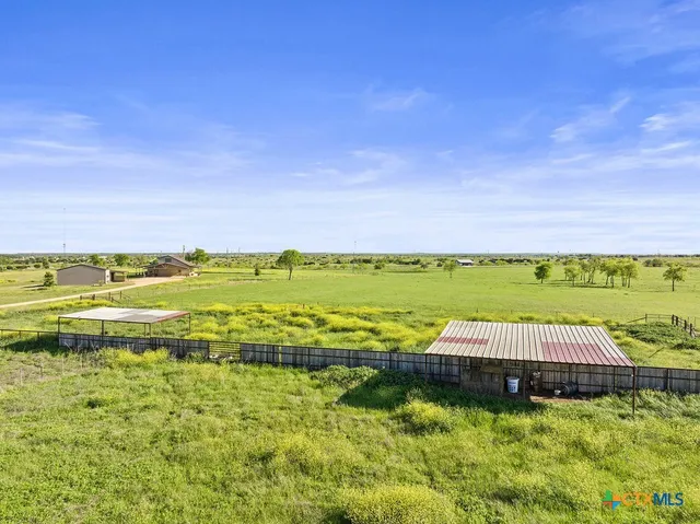 a front view of a house with a yard and a garage