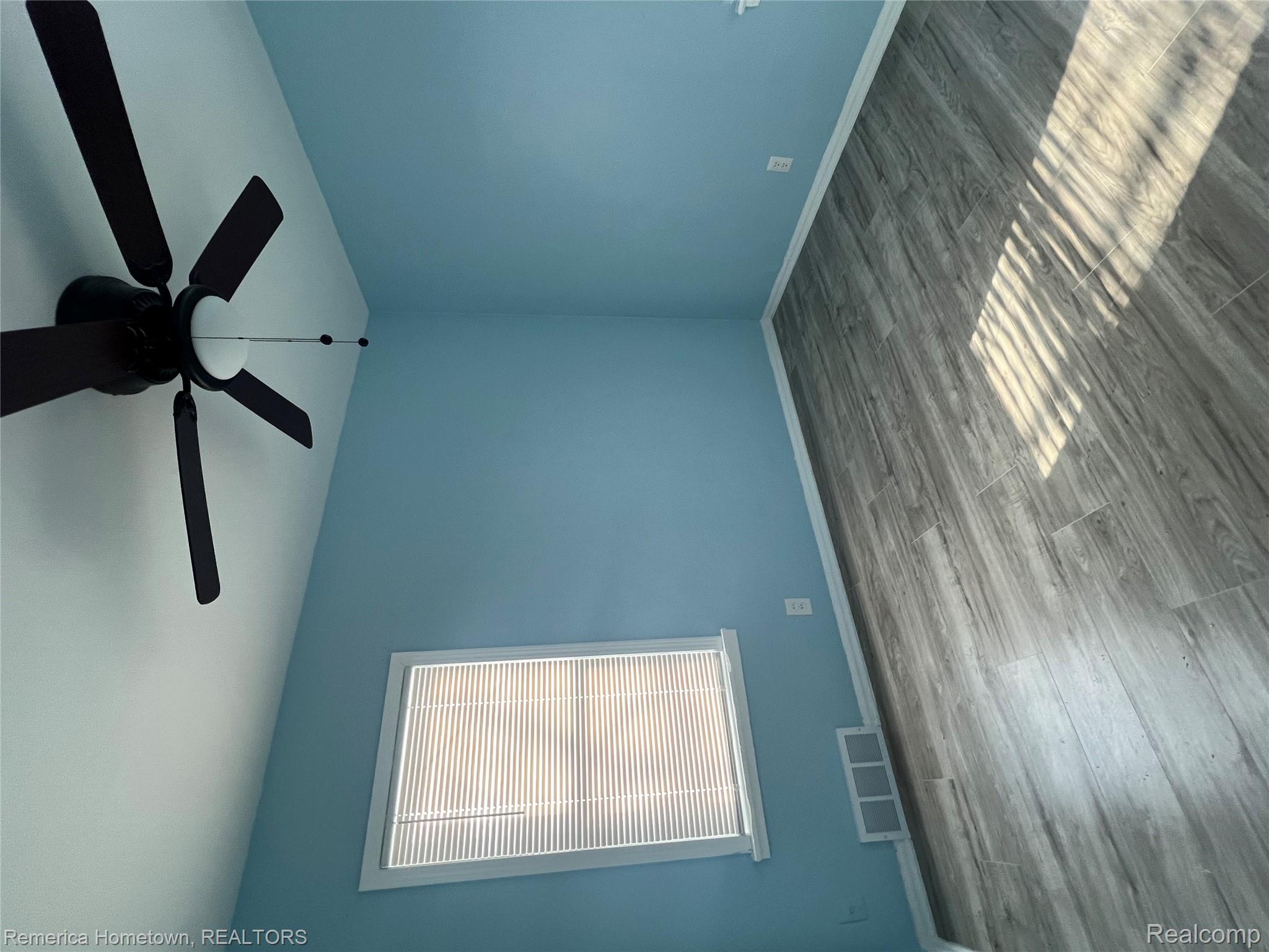 26159 Stanford Street Inkster, MI 48141 - Photo 10 of 16 Unfurnished room featuring a ceiling fan and wood finished floors