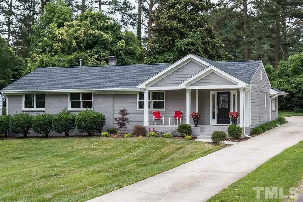 3411 Leonard Street Raleigh, NC 27607 - Photo 1 of 25 a front view of a house with garden