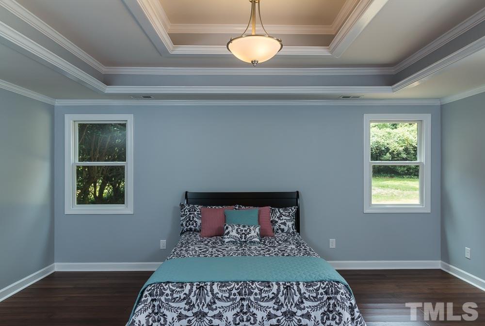 3411 Leonard Street Raleigh, NC 27607 - Photo 10 of 25 a bedroom with a bed and a window