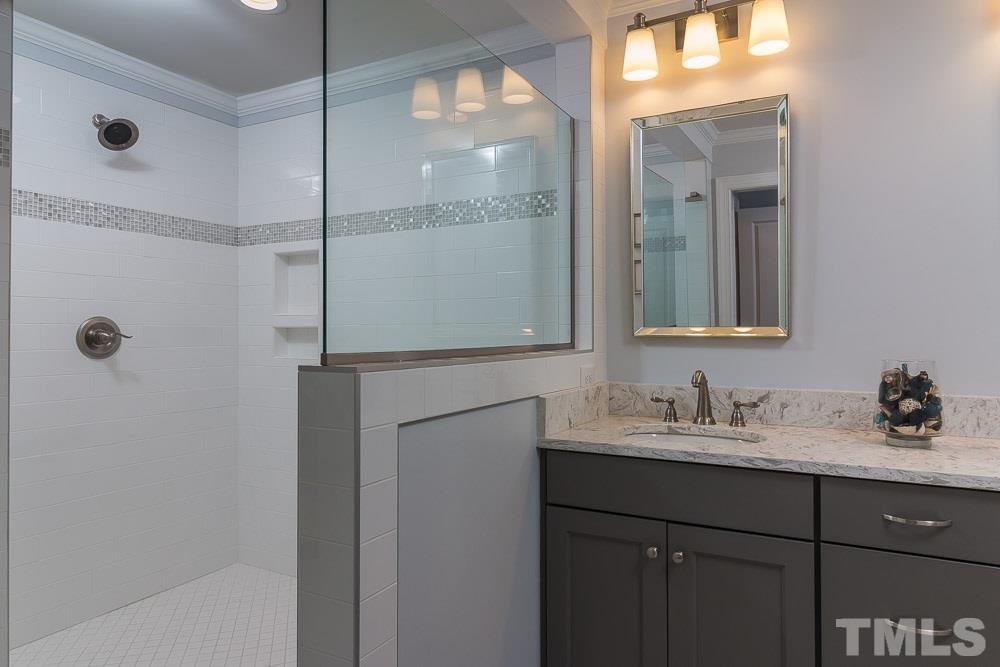 3411 Leonard Street Raleigh, NC 27607 - Photo 12 of 25 a bathroom with a sink and a mirror
