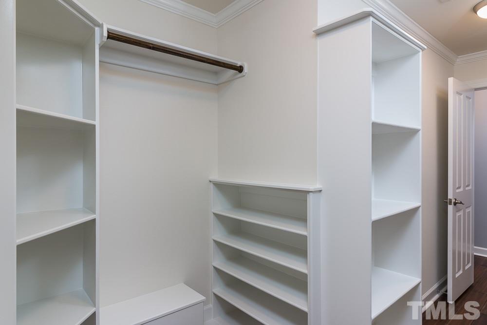 3411 Leonard Street Raleigh, NC 27607 - Photo 16 of 25 a view of walk in closet with empty racks