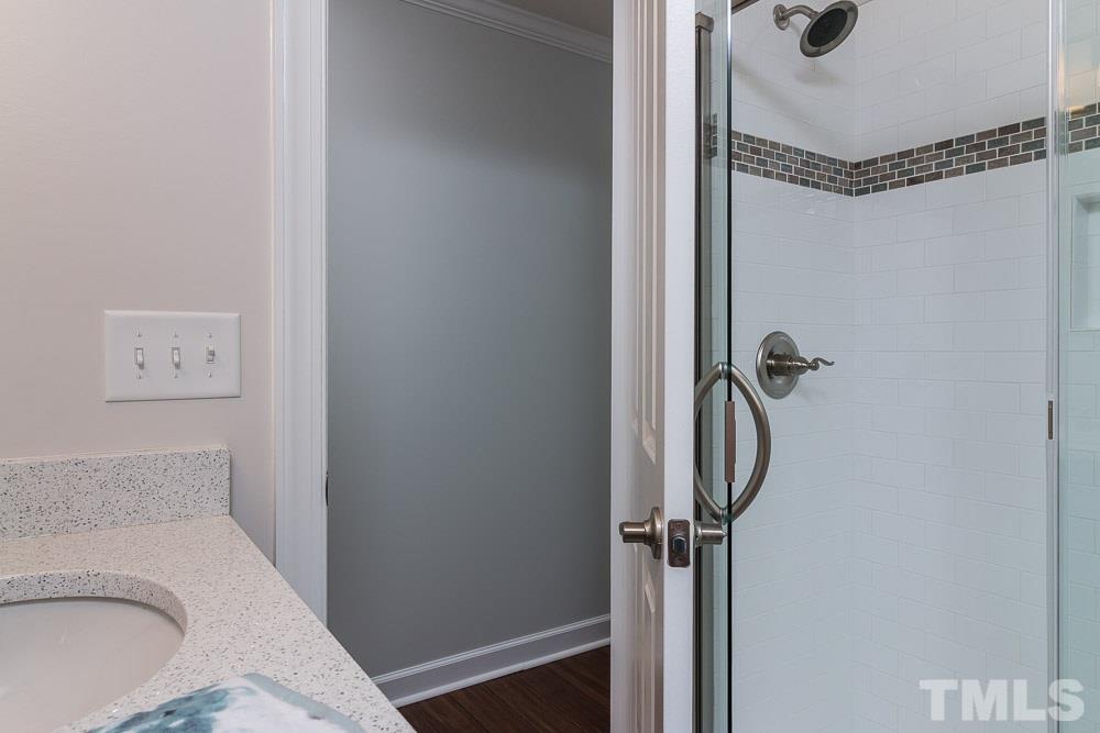 3411 Leonard Street Raleigh, NC 27607 - Photo 20 of 25 a bathroom with a sink toilet and shower