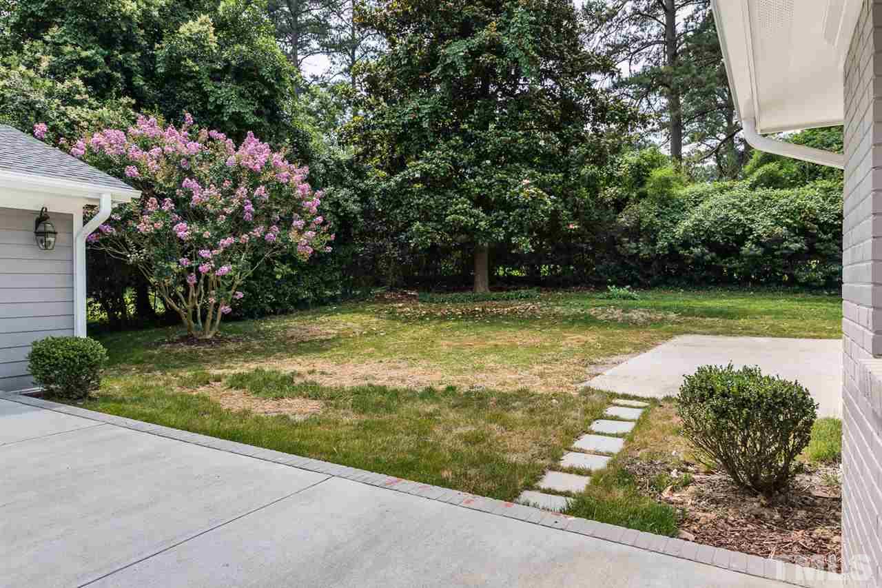 3411 Leonard Street Raleigh, NC 27607 - Photo 22 of 25 a view of a swimming pool with a yard
