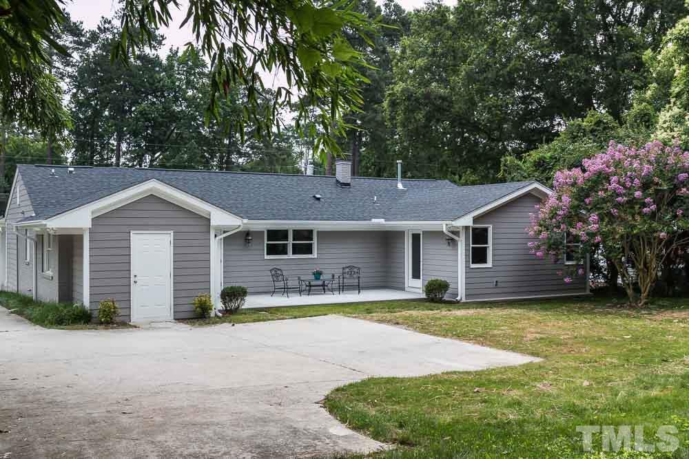 3411 Leonard Street Raleigh, NC 27607 - Photo 23 of 25 a front view of a house with yard and green space