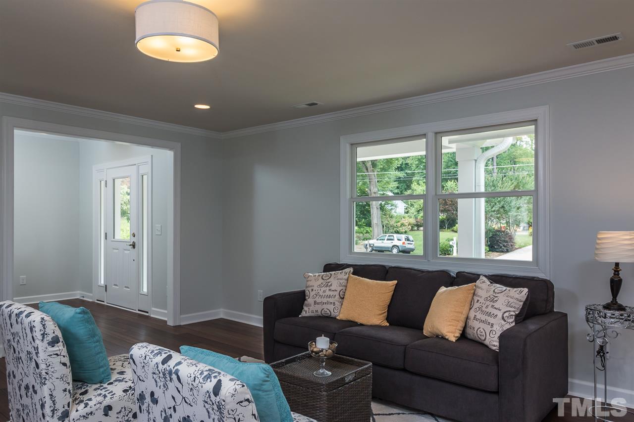 3411 Leonard Street Raleigh, NC 27607 - Photo 7 of 25 a living room with furniture and a large window