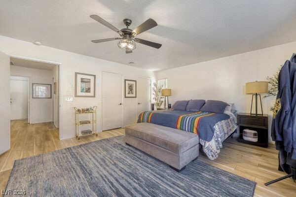 1536 Pony Ranch Circle Henderson, NV 89014 - Photo 14 of 23 Bedroom with light wood-type flooring, ceiling fan, and a closet