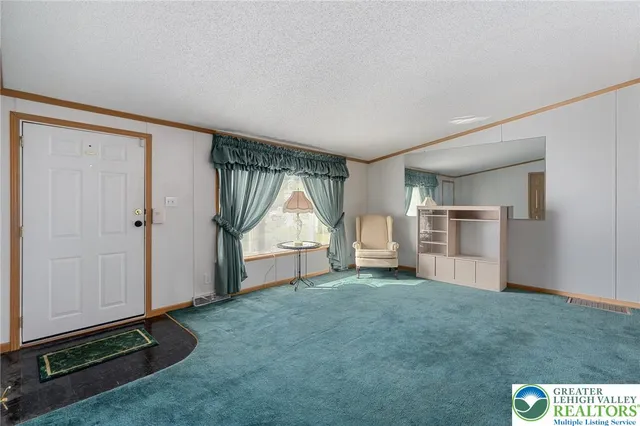 a living room with furniture and a table