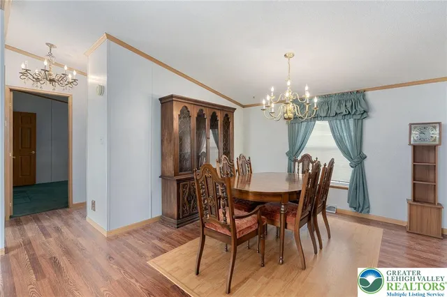 a large kitchen with stainless steel appliances granite countertop a stove a sink dishwasher and a refrigerator