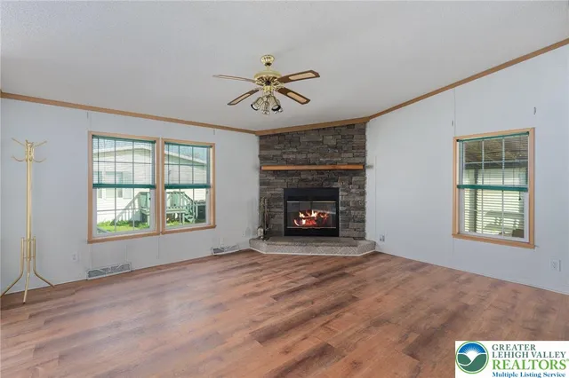 a fireplace with a clock on wall
