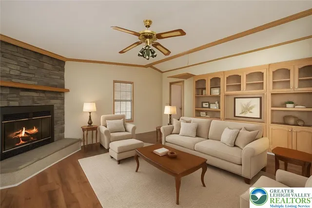 a view of a livingroom with a ceiling fan and window