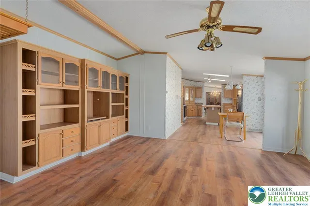 a bathroom with a granite countertop sink a large mirror and a bathtub